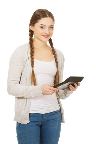 Woman holds digital calculator. - Fotografie, Obrázek