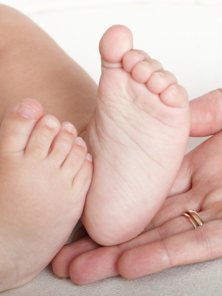 Baby foot in mother hands - Photo, Image
