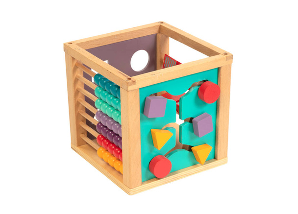 Wooden eco-friendly busy board cube - educational toy for children and babies on a white isolated background - Photo, Image