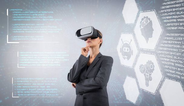 Business woman with VR goggles standing while making decision for using chat bot in business marketing plan. Project manager looking at holographic of AI assistance by using VR glasses. Contraption. - Photo, Image