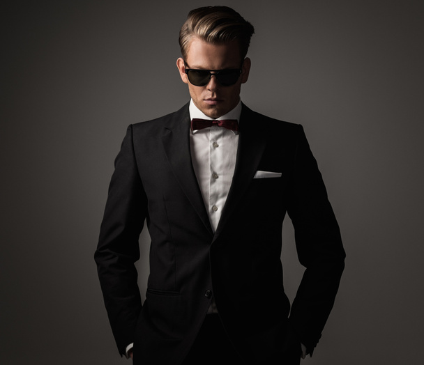 Confident sharp dressed man in black suit  - Photo, Image