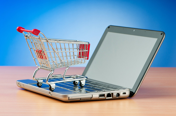 Internet-ostoksia käsite tietokoneen ja ostoskorin
 - Valokuva, kuva
