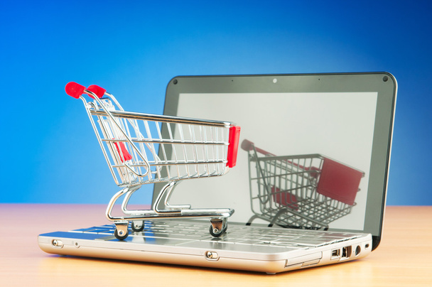 Shopping online with computer and cart - Fotografie, Obrázek