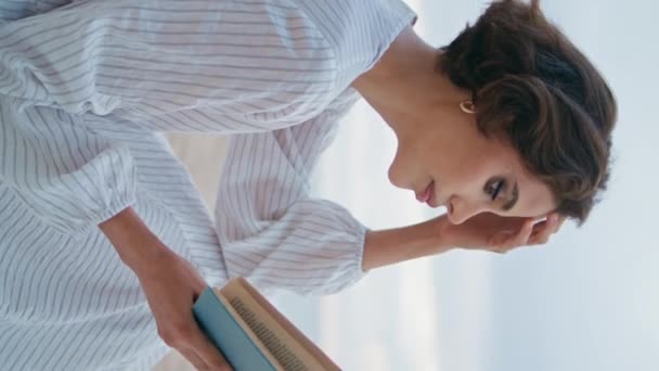 Outdoor woman enjoy book at cloudy seashore vertically oriented closeup. Romantic lady resting sandy ocean beach on summer vacation. Stylish girl reading relaxing on picnic. Serene day at seaside. - Footage, Video