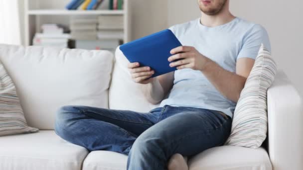 close up of man playing game on tablet pc at home - Filmmaterial, Video