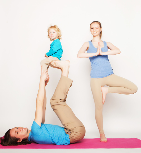 mother, father and son doing yoga - Fotoğraf, Görsel