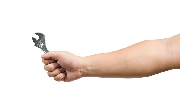 Hand holding a spanner - 写真・画像