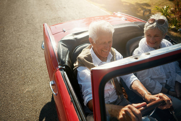 Senior, couple and driving convertible for road trip holiday or countryside retirement, transportation or travel. Man, woman and old people on vacation journey in California, explore or happiness. - Valokuva, kuva