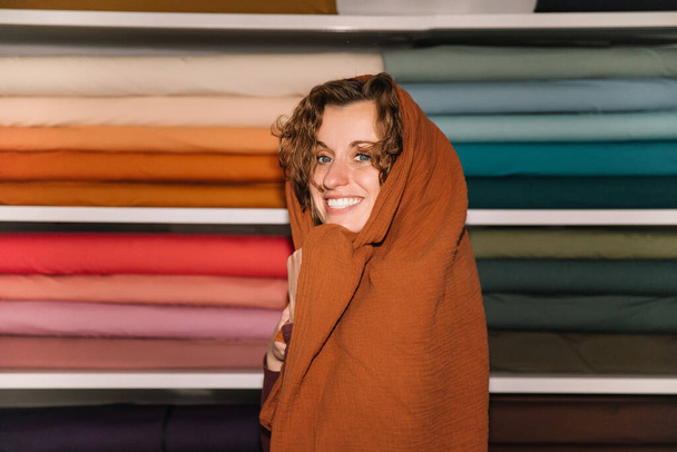 Playful Fashion Designer Wrapped in Warmth Textile Shop - Fotografie, Obrázek