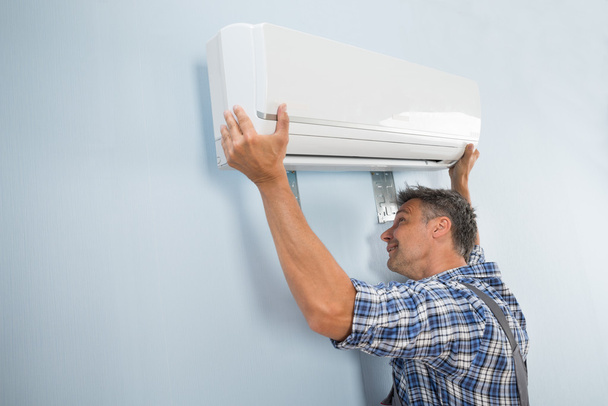 Technician Fixing Air Conditioner - Photo, Image