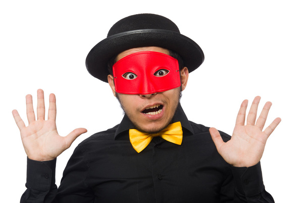 Молодой человек в черном костюме и красной маске изолирован на белом - Фото, изображение