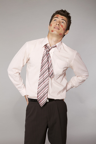 Businessman with lipstick kiss marks - Foto, afbeelding