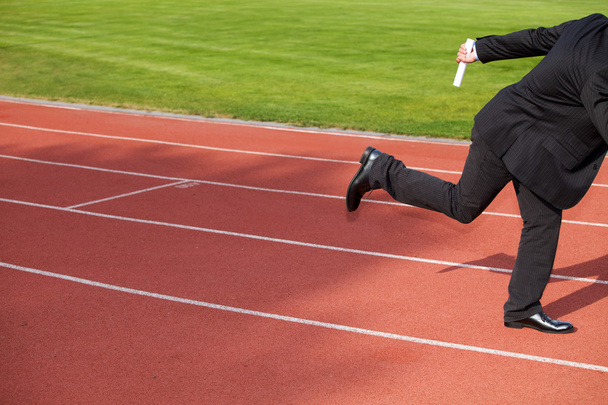 Businessman running on  track - Фото, зображення
