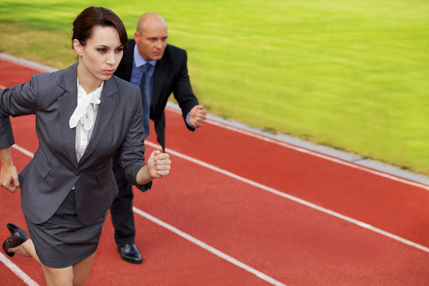 Businessman and woman on running - Photo, Image
