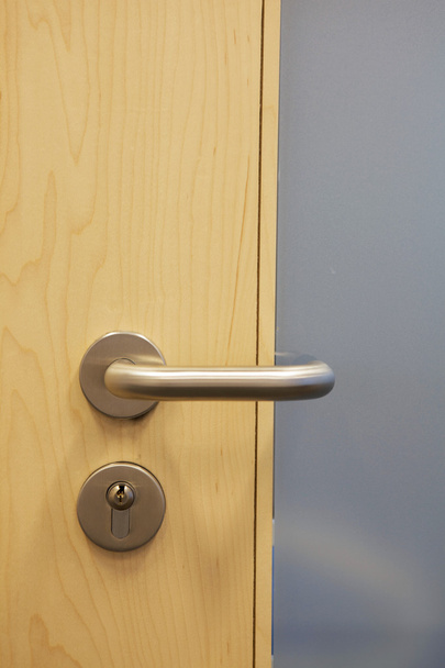 Closed door with doorknob - Foto, afbeelding