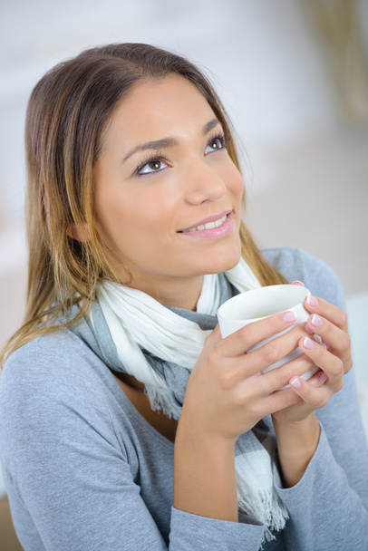 Woman having a coffee at home - Фото, изображение