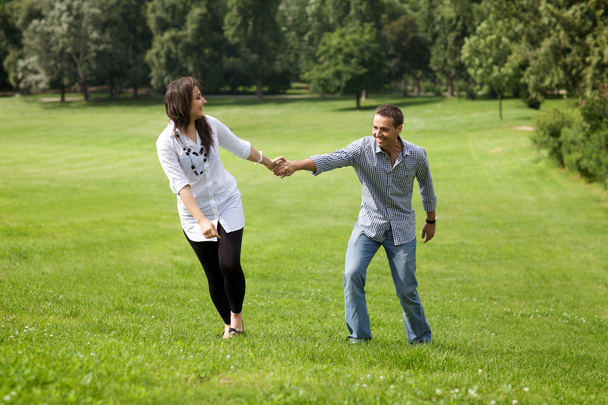 couple enjoying in park - Zdjęcie, obraz