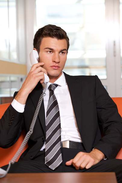 Businessman conversing on  phone - Foto, imagen