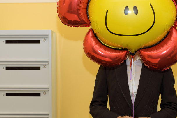 Business person holding balloon - Foto, immagini