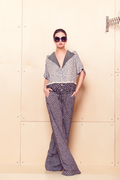 Full height portrait of a young woman in pantsuit - Foto, afbeelding