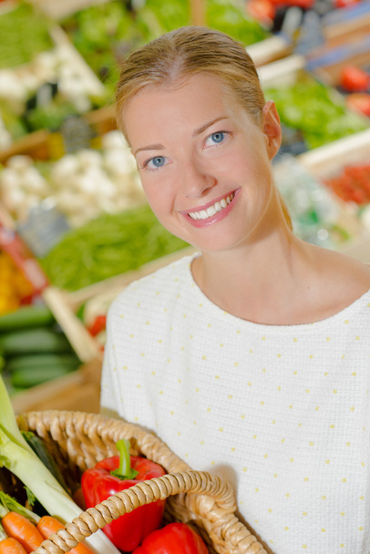 Woman shopping for fresh vegetables - Fotó, kép