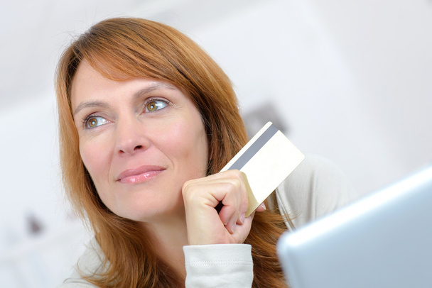 Woman doing some on-line shopping - Foto, imagen
