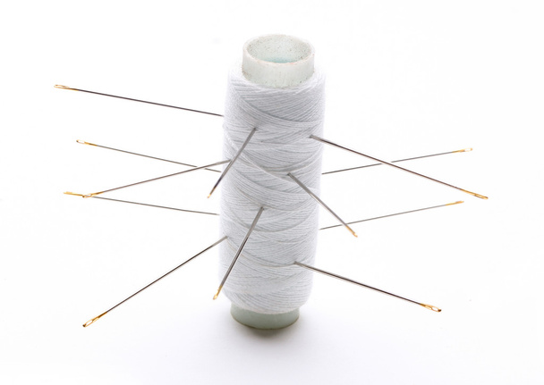 Needle and thread isolated over white background - Photo, Image