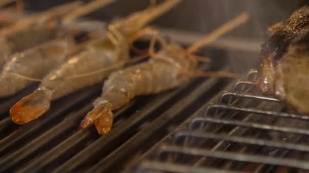 Horizontal dolly shot of fire grill with tempting delicious fish - Záběry, video
