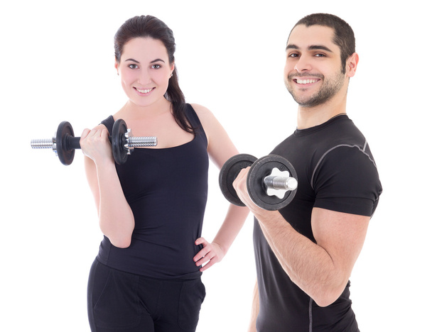happy man and woman in sportswear doing exercises with dumbbells - Φωτογραφία, εικόνα