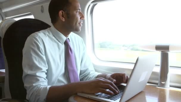 Businessman working at laptop On Train - Video