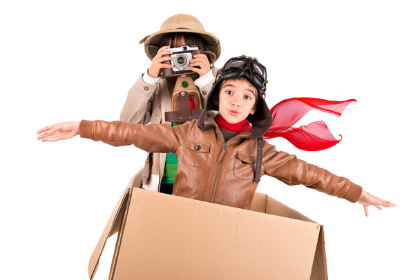 Boy and girl in box on white - Фото, зображення