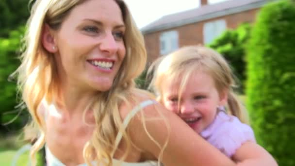 Mother And Daughter Having Fun In Garden - Footage, Video