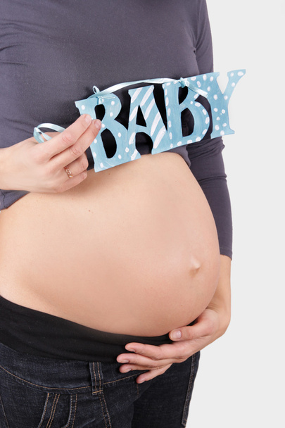 Vientre de mujer embarazada
 - Foto, Imagen