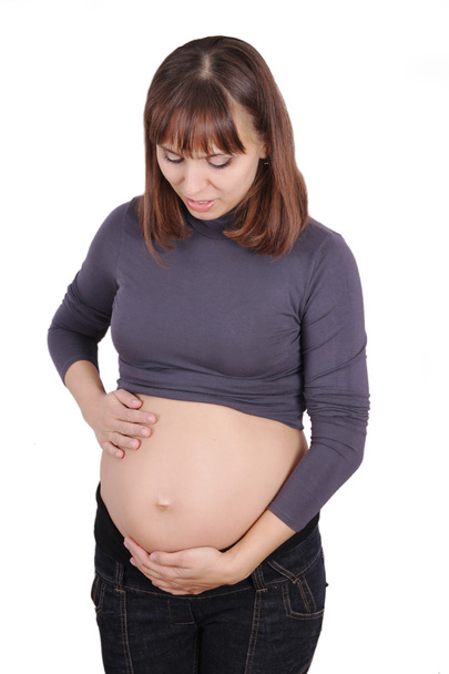 Pregnant woman holding belly - Fotoğraf, Görsel