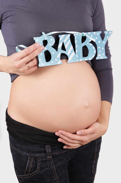 Pregnant woman belly - Фото, изображение