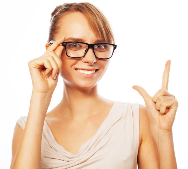 woman wearing glasses pointing up - Photo, image