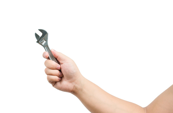 Mão segurando uma chave inglesa
 - Foto, Imagem