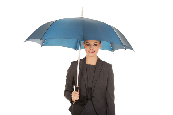 Businesswoman holding an umbrella - Photo, image