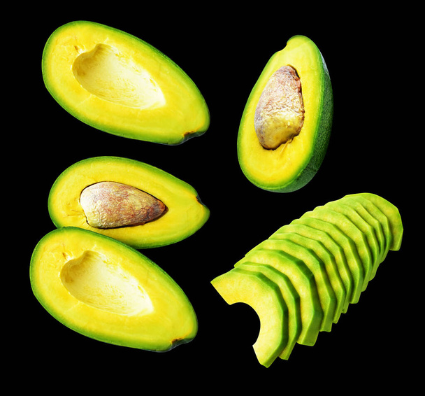 Avocado slice isolated with clipping path, no shadow in black background - Photo, Image