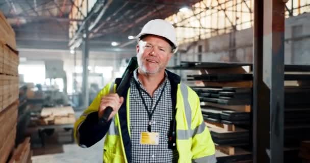 Mature man, manager and smile at factory or warehouse with building material for construction. Supplier, supervisor and portrait with hammer in manufacturing and distribution business with happiness. - Footage, Video