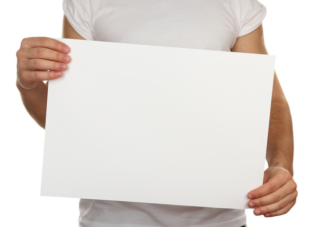 Blank sheet of paper in male hands isolated on white - Fotó, kép