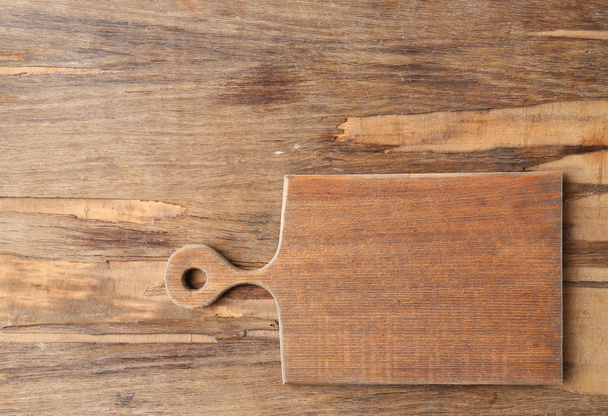 Cutting board on wooden background - Fotoğraf, Görsel