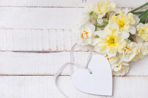 Background with fresh daffodils and heart - Zdjęcie, obraz