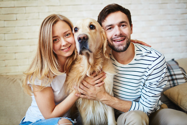 Young couple and their dog - Photo, Image