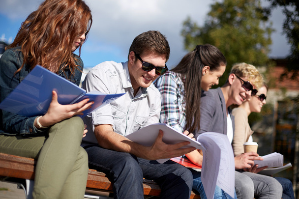 group of happy students with notebooks at campus - Valokuva, kuva