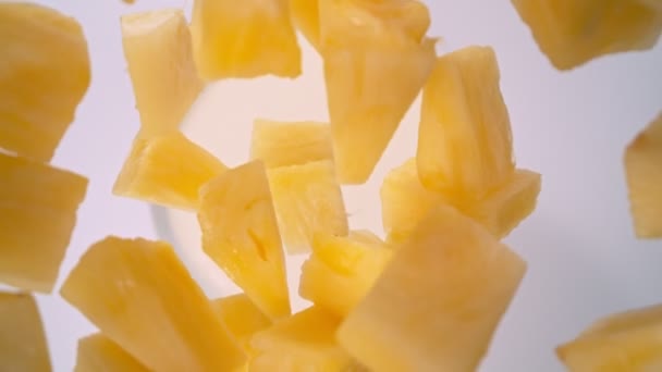 Super Slow Motion Shot of Pineapple Cuts Followed by Camera Falling into Cream at 1000fps. Filmed with High Speed Cinema Camera, 4K. - Кадри, відео