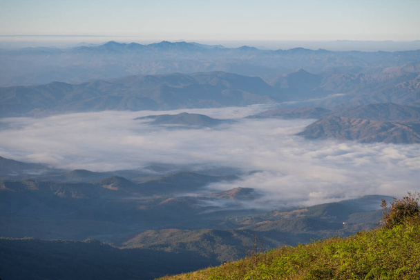  beautiful view of mountain with clouds at sunrise (Doi Inthanon National Park, Chiang Mai), soft focus - Foto, imagen