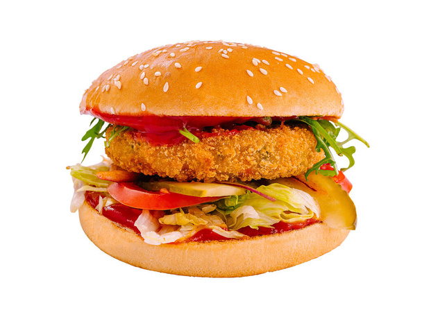 Tasty chicken burger with fresh vegetables and sauce on a sesame bun isolated on a white background - Fotoğraf, Görsel