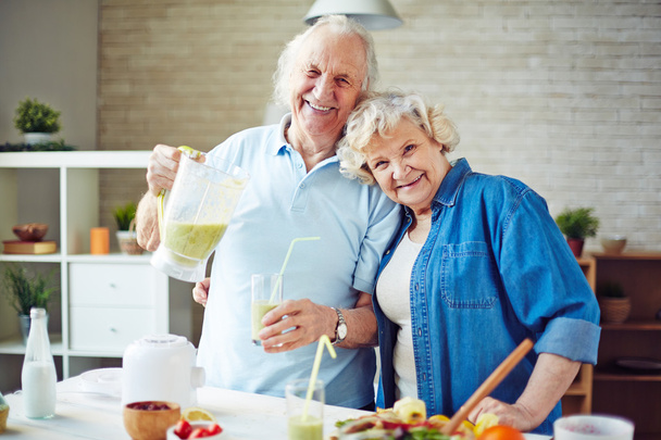 Senior couple having fresh smoothie - Photo, Image