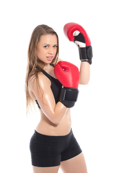女性が赤いボクシング グローブのポーズ - 写真・画像
